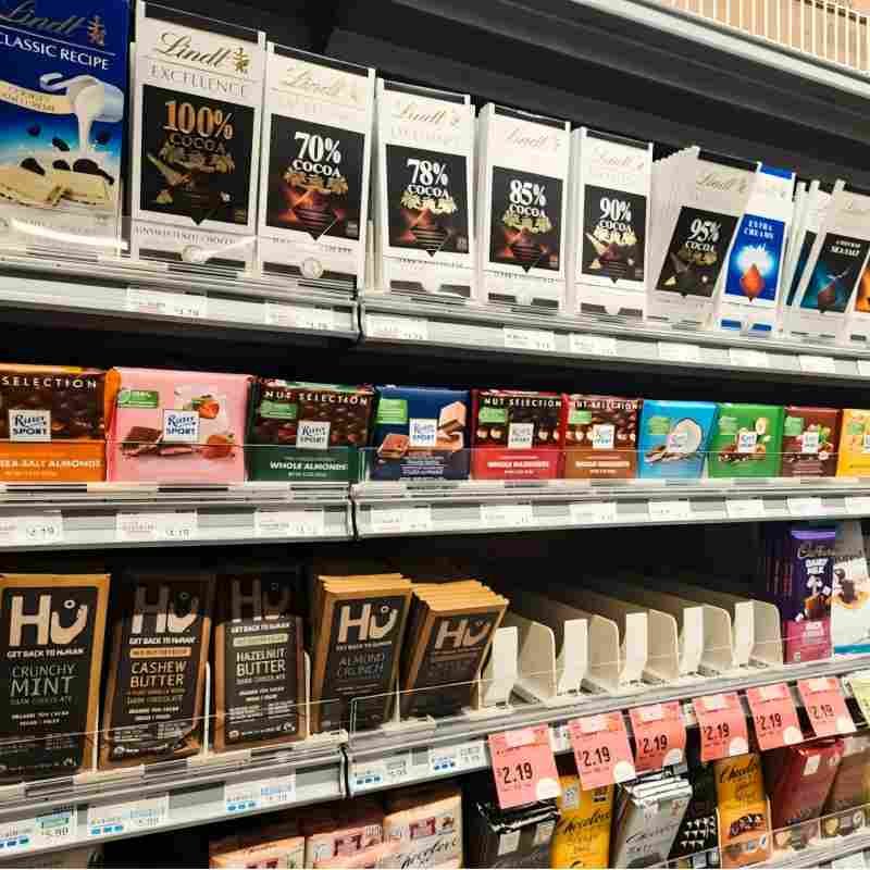 Retail-ready packaging boxes displayed on a modern store shelf